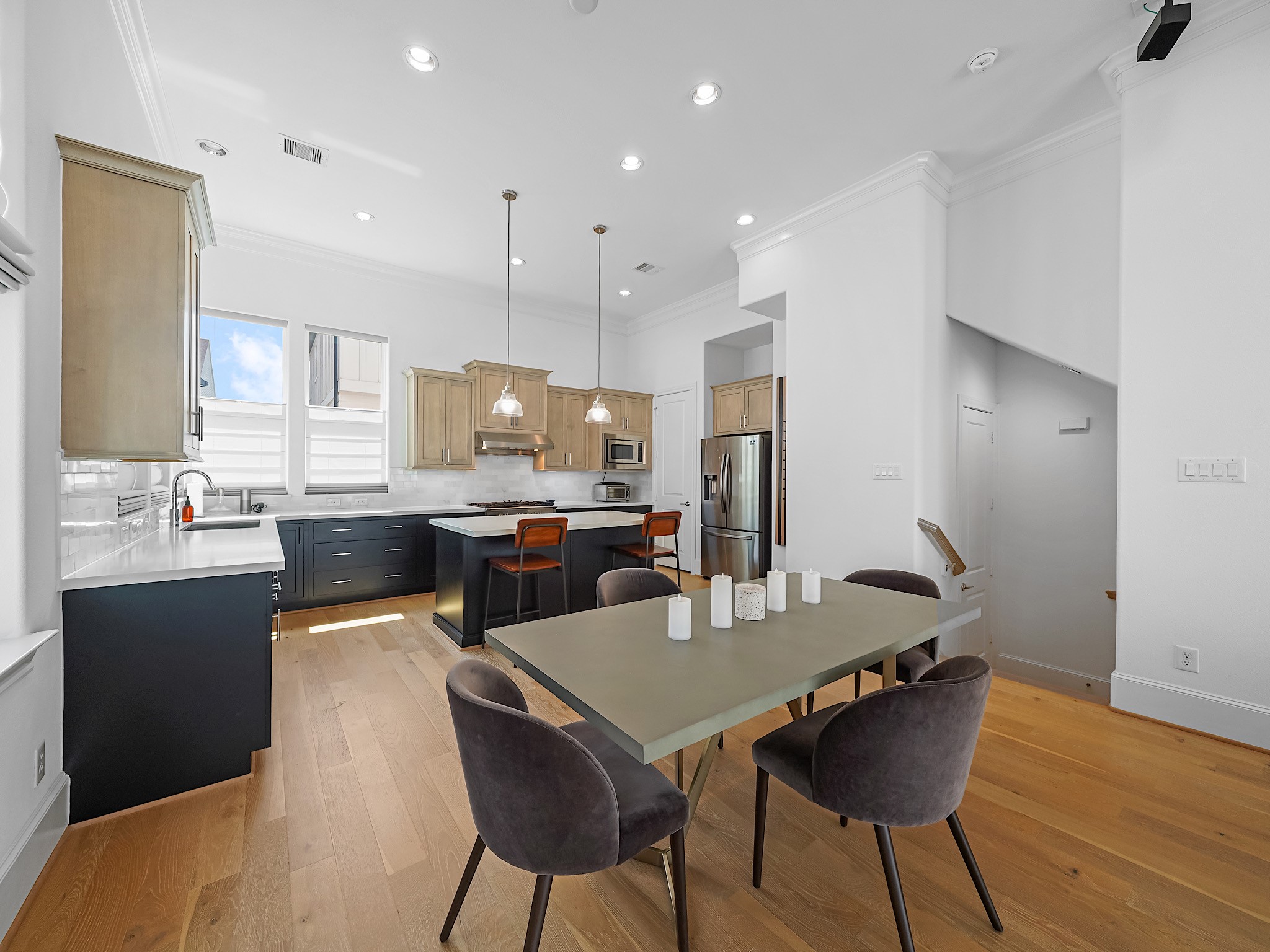 3411 Timbergrove Heights Street Houston, TX 77008 - Photo 16 of 33 a kitchen with a dining table chairs and refrigerator