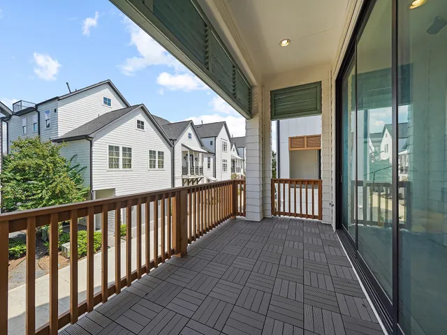 a view of a house with wooden deck