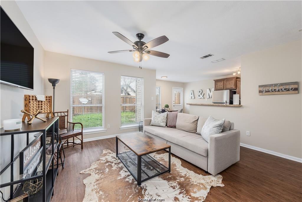 1217 Oney Hervey Drive College Station, TX 77840 - Photo 5 of 22 a living room with furniture a flat screen tv and a large window