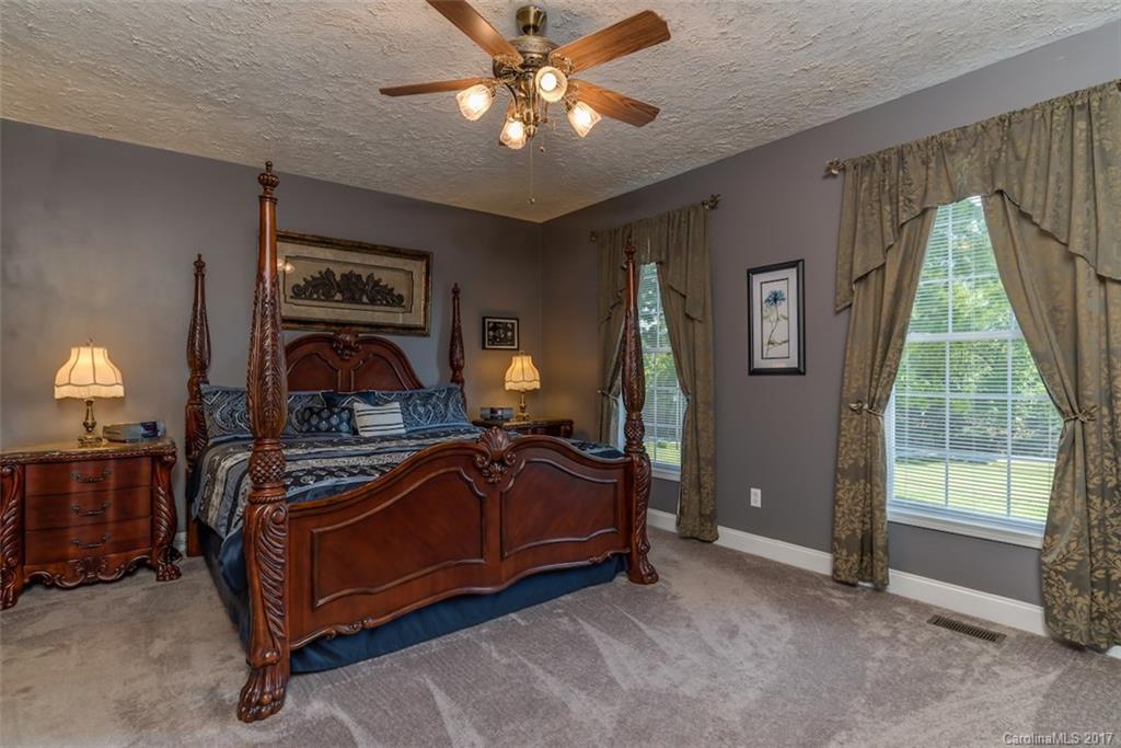 4144 Us 64/74a Road Rutherfordton, NC 28139 - Photo 11 of 24 a bedroom with a bed and a chandelier