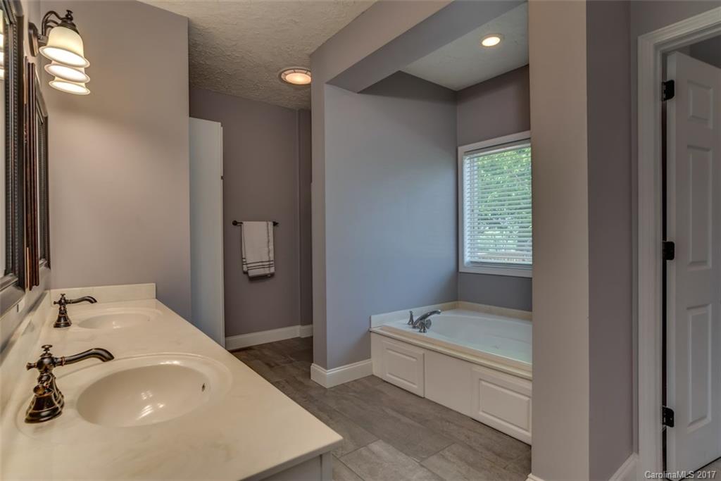 4144 Us 64/74a Road Rutherfordton, NC 28139 - Photo 12 of 24 a bathroom with a sink and a mirror