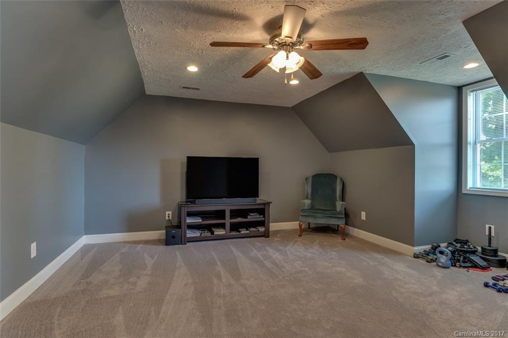 4144 Us 64/74a Road Rutherfordton, NC 28139 - Photo 13 of 24 a living room with furniture and a flat screen tv