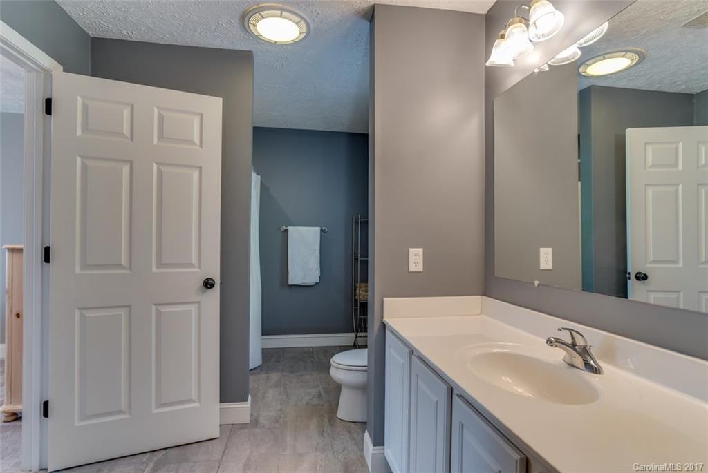 4144 Us 64/74a Road Rutherfordton, NC 28139 - Photo 15 of 24 a bathroom with a toilet a sink and mirror