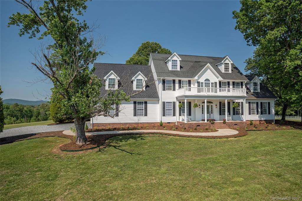 4144 Us 64/74a Road Rutherfordton, NC 28139 - Photo 20 of 24 a front view of a house with a garden and trees