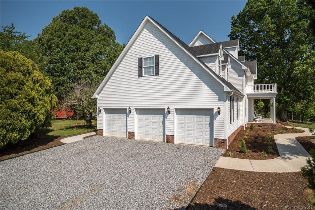 4144 Us 64/74a Road Rutherfordton, NC 28139 - Photo 21 of 24 a view of a house with a yard and large tree