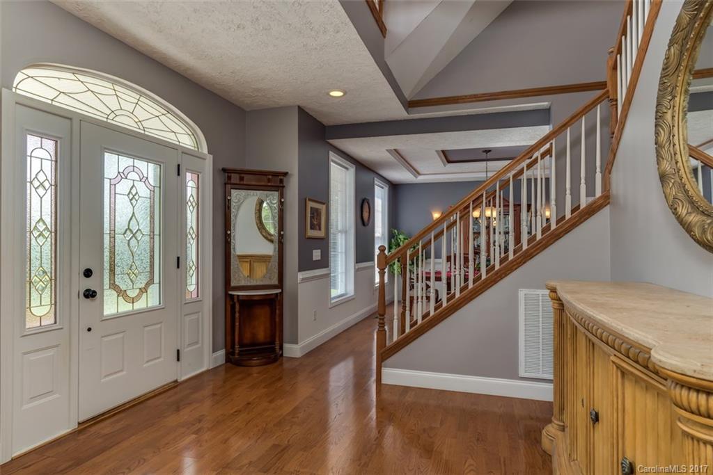 4144 Us 64/74a Road Rutherfordton, NC 28139 - Photo 4 of 24 a view of an entryway with wooden floor fireplace and windows