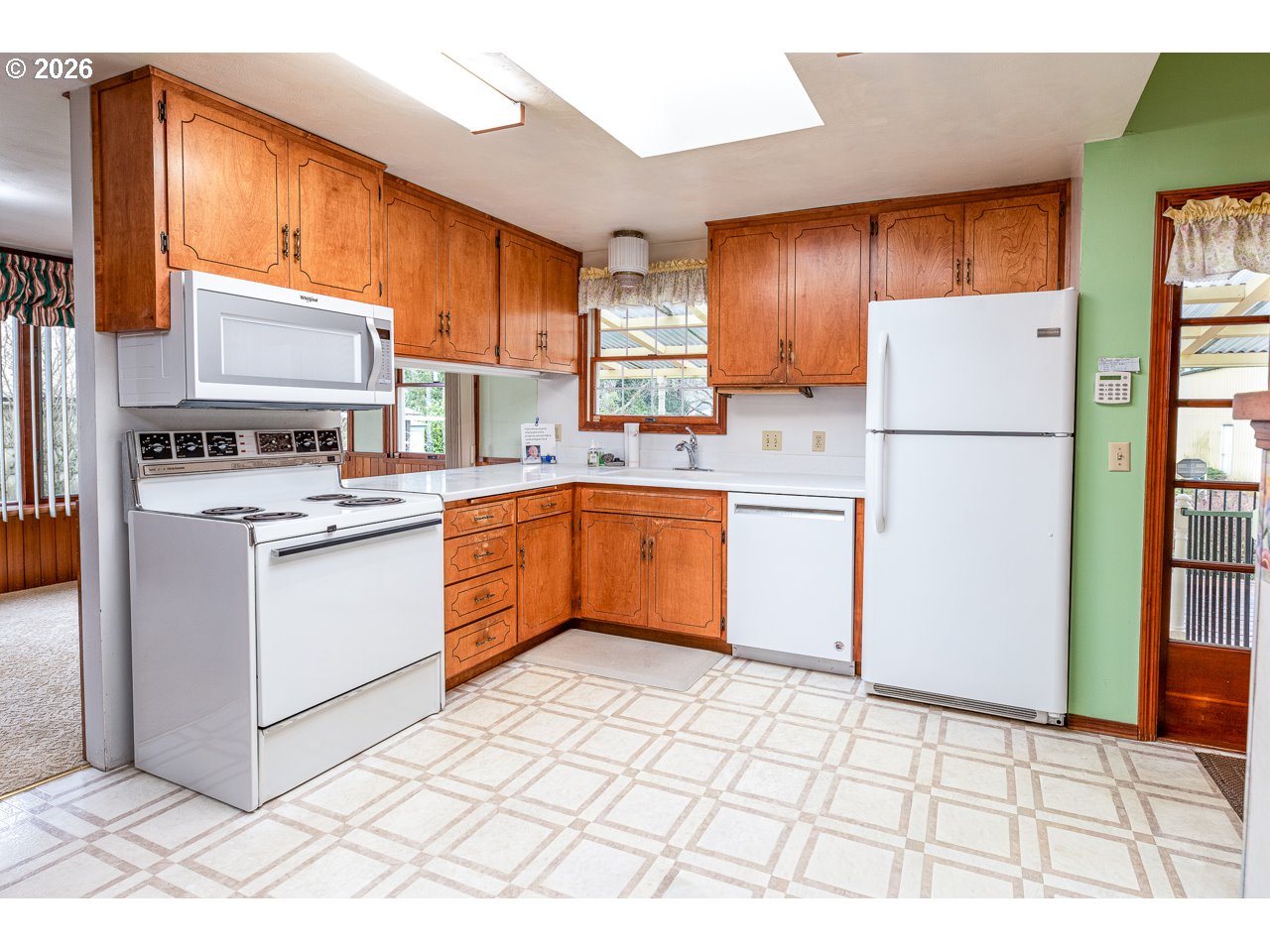 89805 Sprague Road Eugene, OR 97408 - Photo 16 of 48 a kitchen with a stove a sink dishwasher and a refrigerator