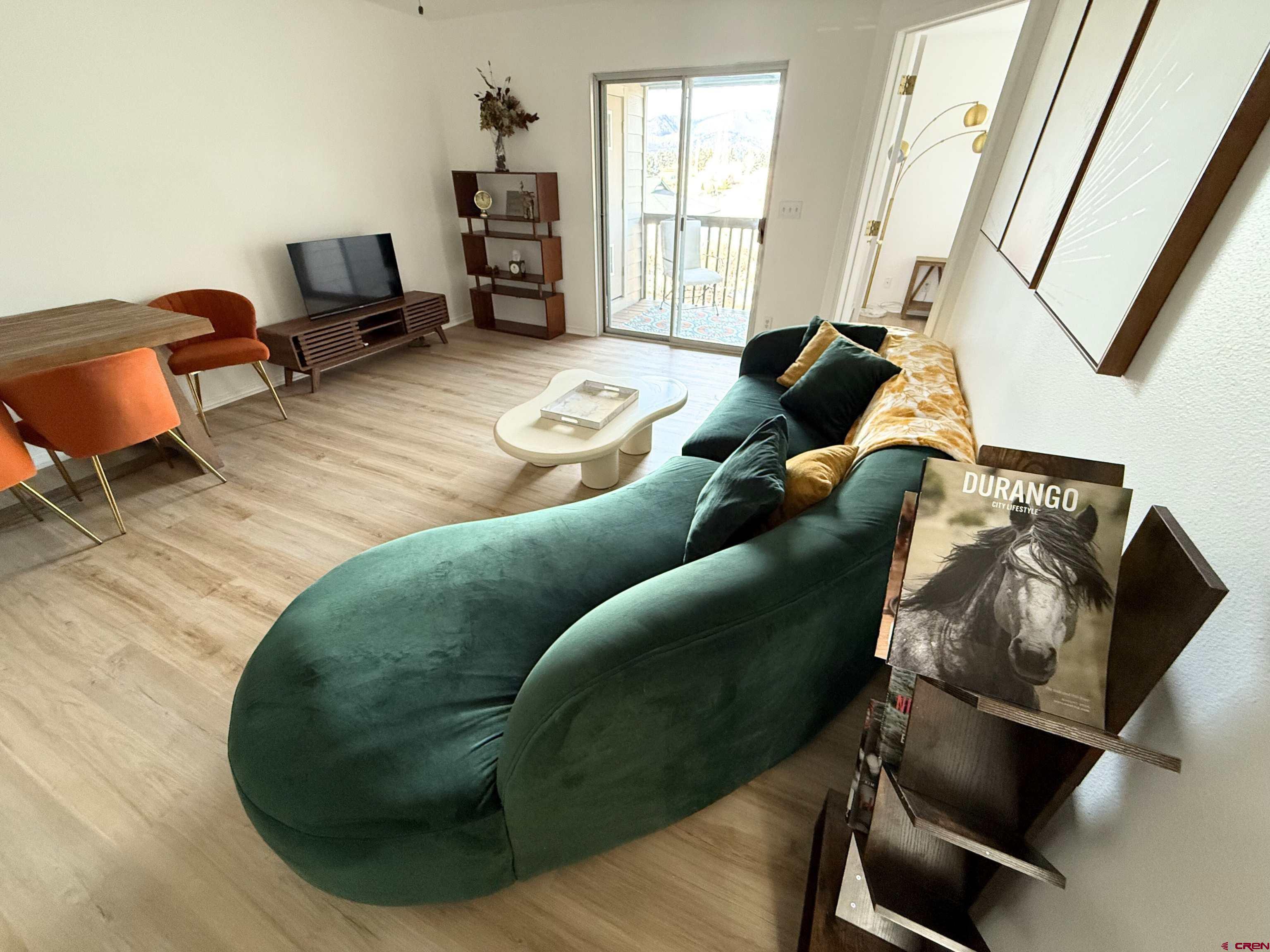 1100 Goeglein Gulch Road, Unit 238 Durango, CO 81301 - Photo 2 of 35 a living room with furniture and a wooden floor