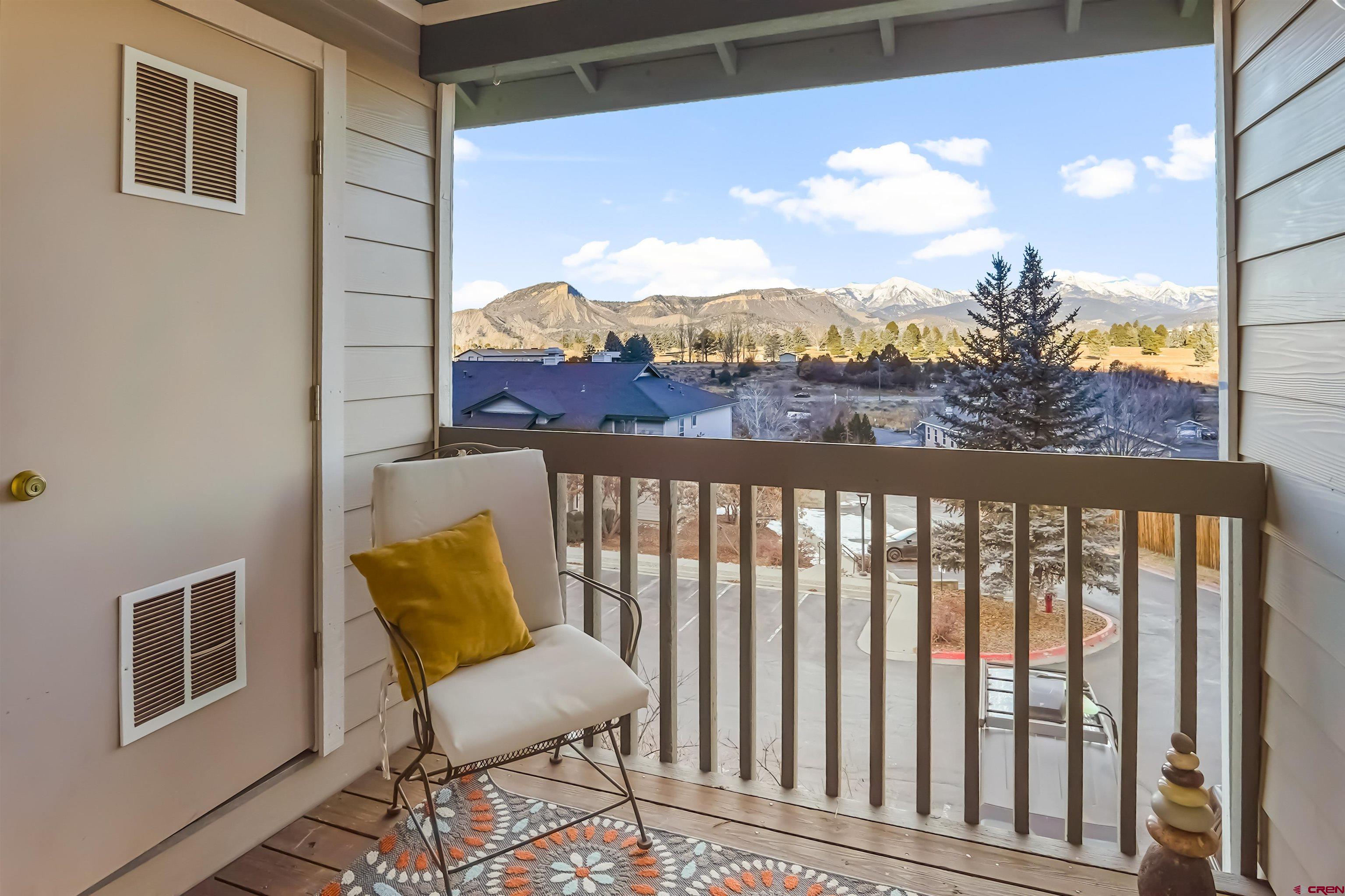 1100 Goeglein Gulch Road, Unit 238 Durango, CO 81301 - Photo 3 of 35 a view of a chair and table in the balcony
