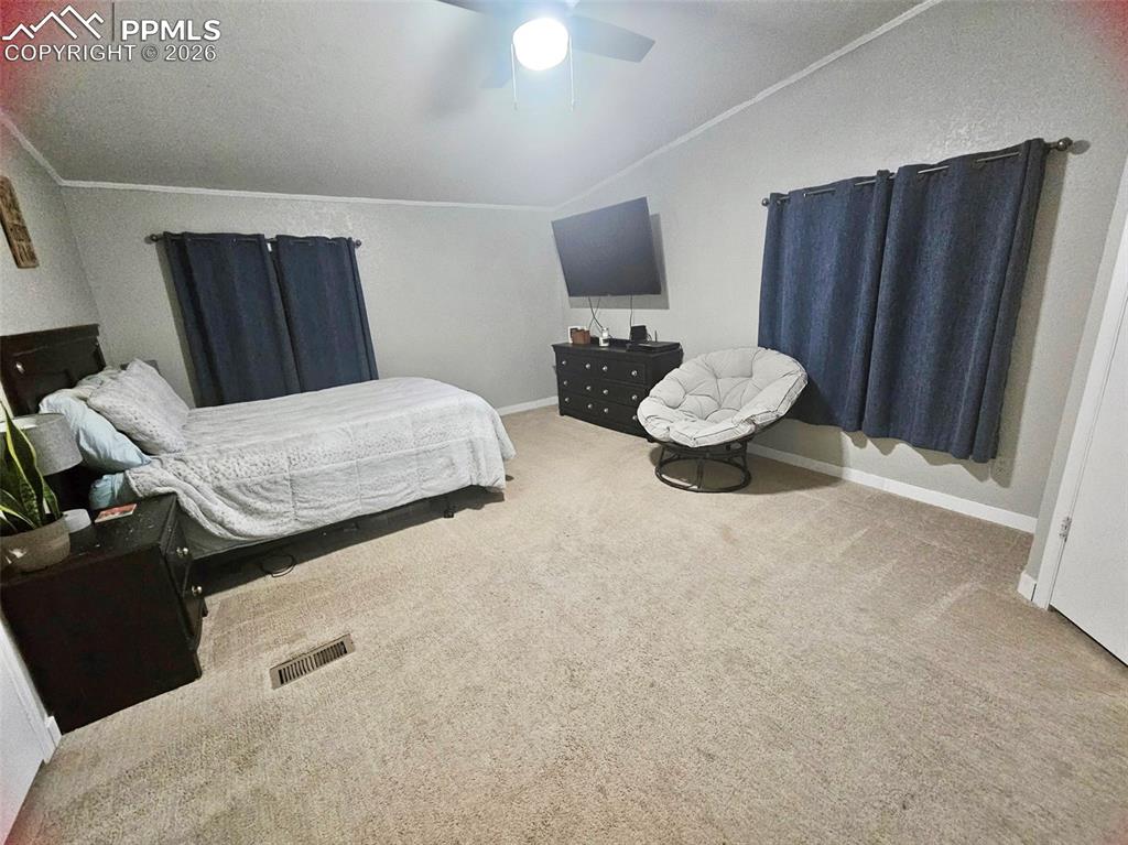 5633 Antelope Road Fountain, CO 80817 - Photo 11 of 19 a bedroom with furniture and a mirror