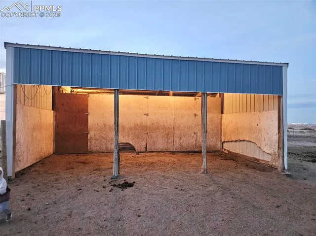 an empty room with sliding glass door