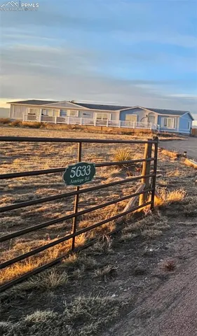a view of an empty room with a fireplace