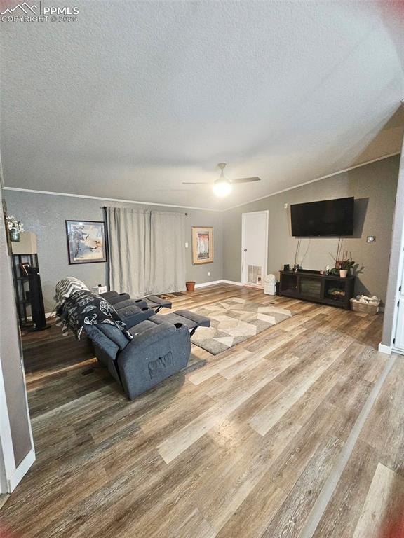 5633 Antelope Road Fountain, CO 80817 - Photo 2 of 19 a living room with furniture and a flat screen tv