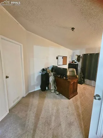 a bed room with furniture and a flat screen tv