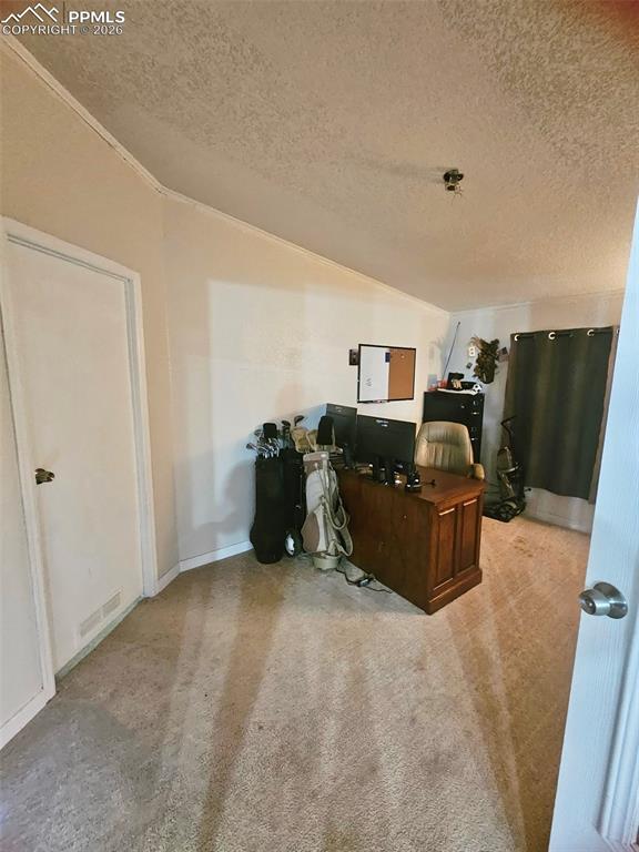 5633 Antelope Road Fountain, CO 80817 - Photo 10 of 19 a bed room with furniture and a flat screen tv