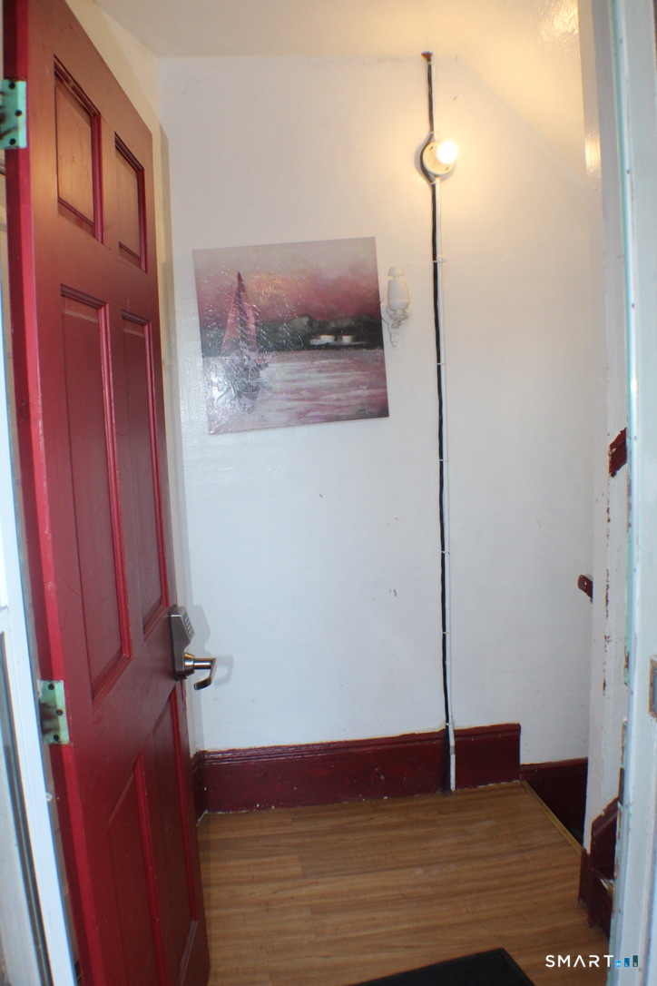 150 Whitney Street Hartford, CT 06105 - Photo 13 of 39 a view of a hallway with wooden floor