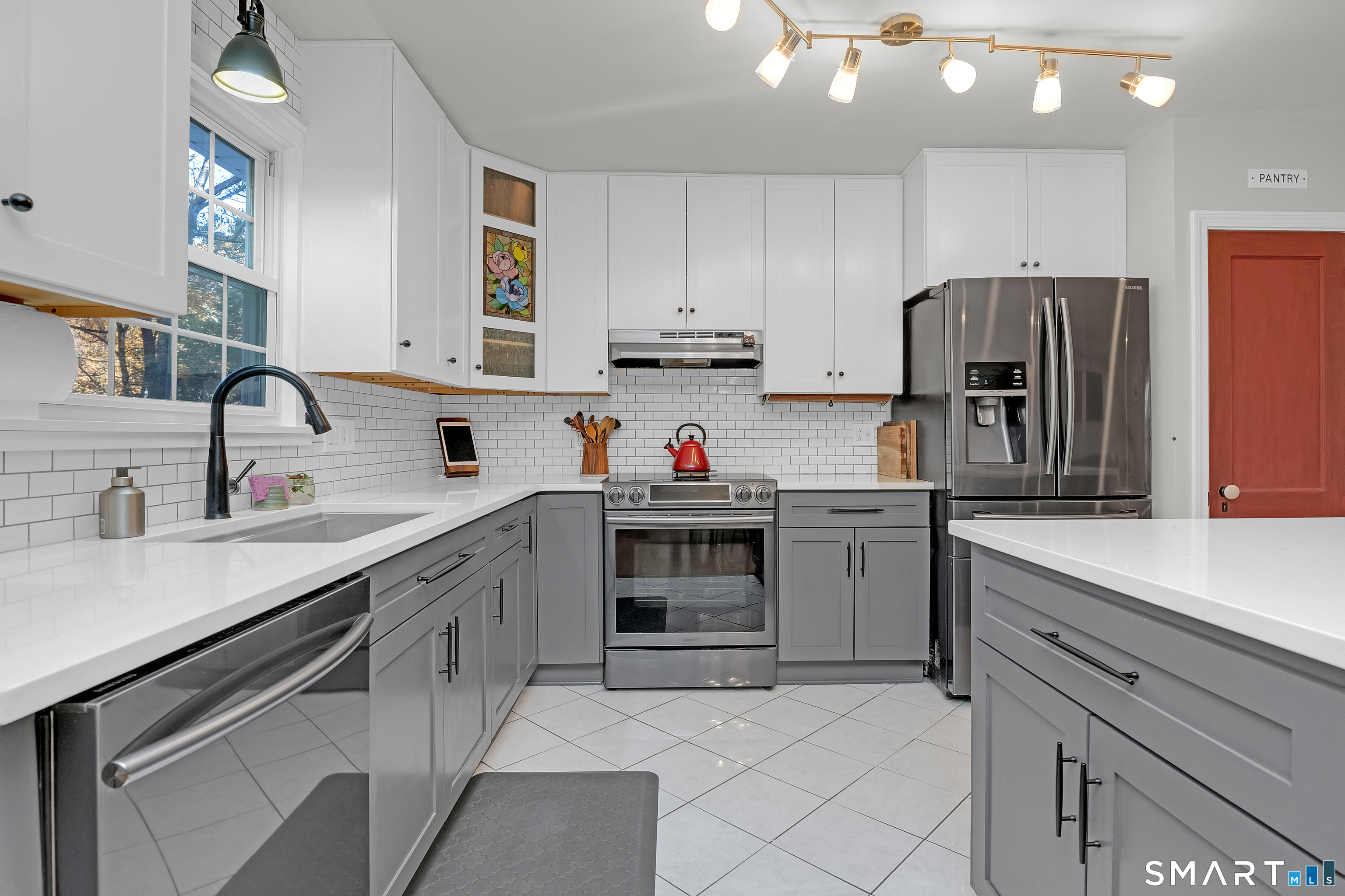 16 Marion Road Bethany, CT 06524 - Photo 8 of 40 a kitchen with a sink cabinets and stainless steel appliances