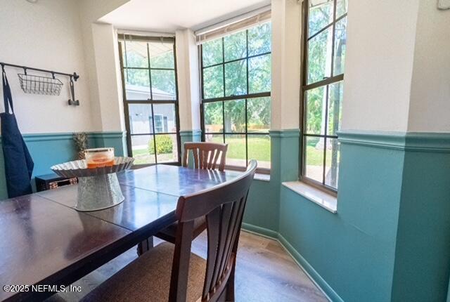 1701 Jones Road Jacksonville, FL 32220 - Photo 11 of 41 a dining room with furniture a chandelier and wooden floor