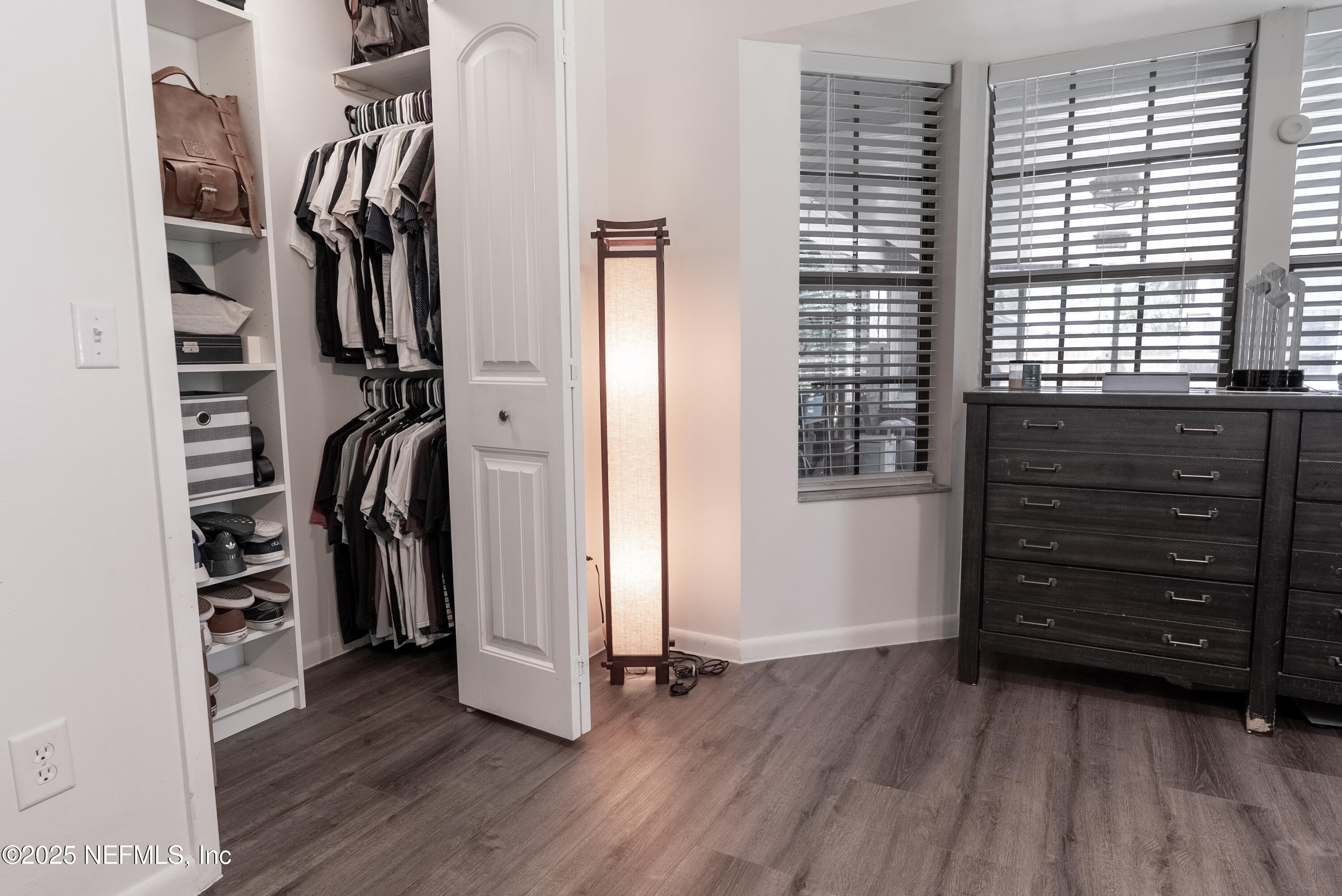 1701 Jones Road Jacksonville, FL 32220 - Photo 14 of 41 a view of walk in closet with clothes and shoes