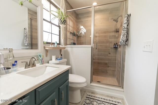 1701 Jones Road Jacksonville, FL 32220 - Photo 16 of 41 a bathroom with a shower sink vanity mirror and toilet