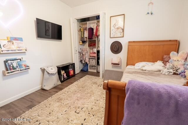 1701 Jones Road Jacksonville, FL 32220 - Photo 20 of 41 a bedroom with furniture and a flat screen tv