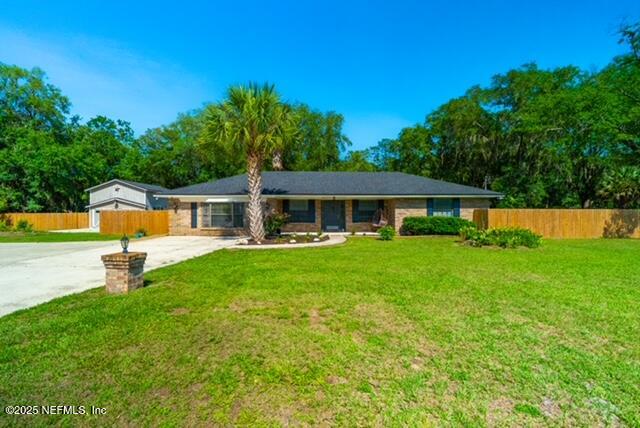 1701 Jones Road Jacksonville, FL 32220 - Photo 2 of 41 a front view of house with a garden and deck