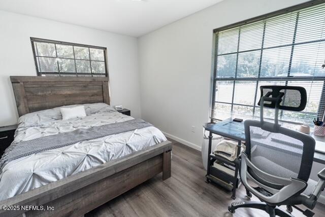 1701 Jones Road Jacksonville, FL 32220 - Photo 25 of 41 a bedroom with a bed a table and chair