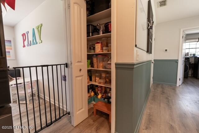1701 Jones Road Jacksonville, FL 32220 - Photo 28 of 41 a view of a hallway with wooden floor and dining room