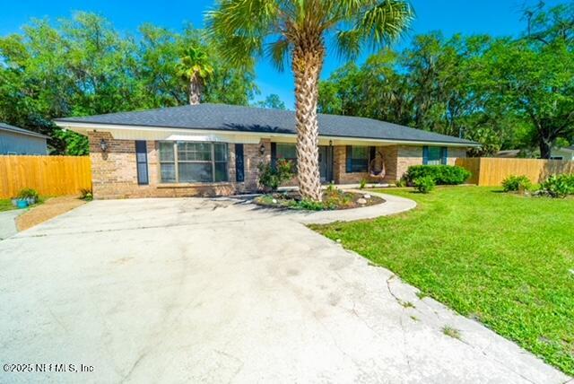 1701 Jones Road Jacksonville, FL 32220 - Photo 3 of 41 front view of a house with a yard