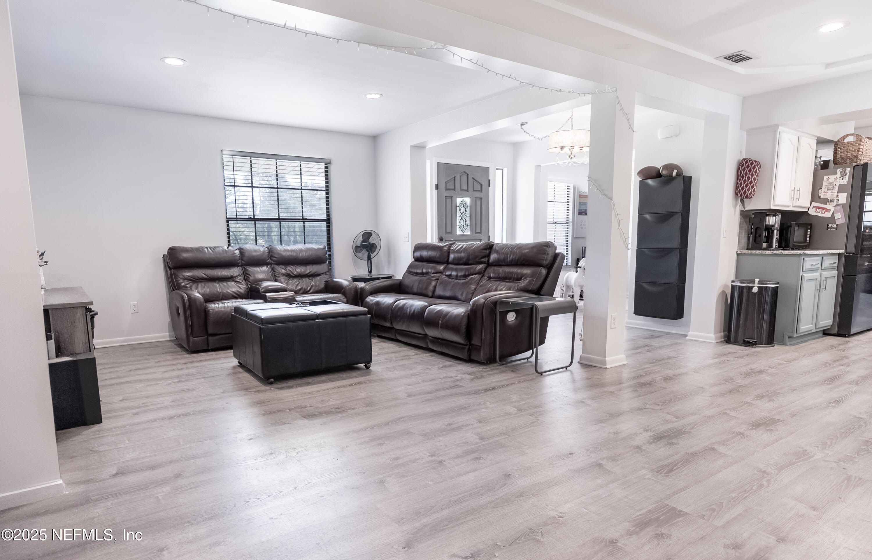 1701 Jones Road Jacksonville, FL 32220 - Photo 7 of 41 a living room with furniture windows and a kitchen view