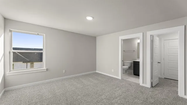a view of a kitchen with a refrigerator and a sink