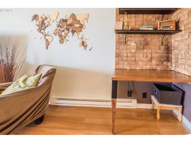 a bedroom with a bed and a night stand