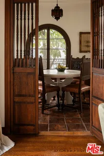 a kitchen with white cabinets and appliances