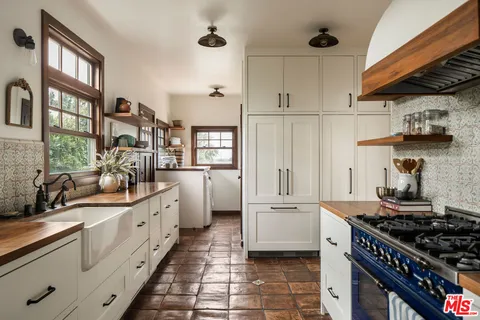 a living room with furniture and a gate