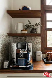 a view of a balcony with chairs and wooden floor