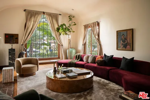 a living room with furniture and a window