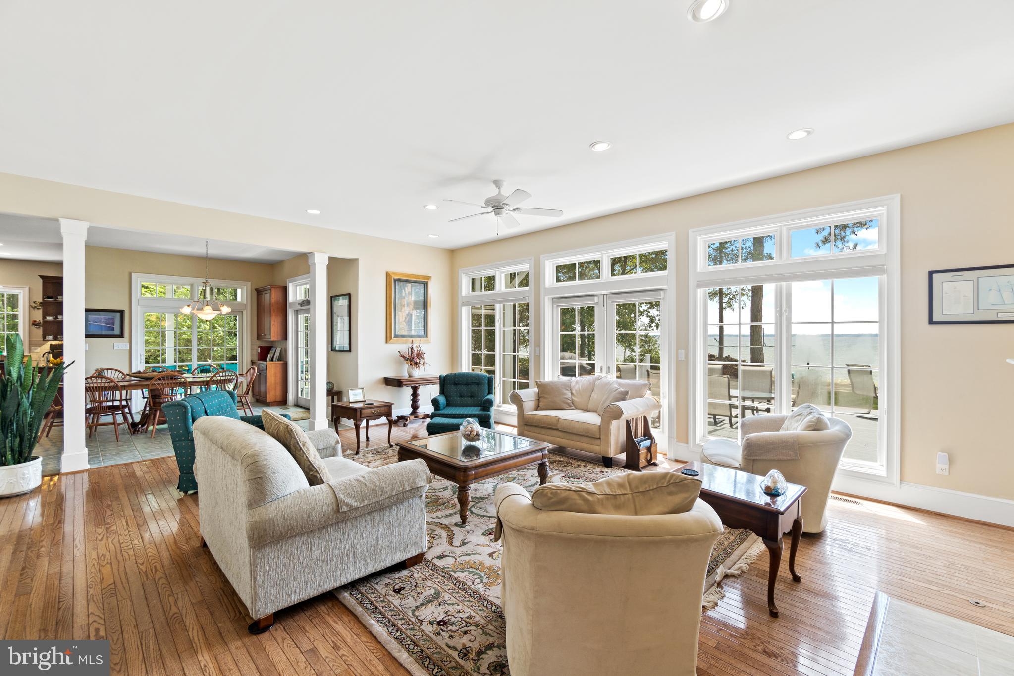 16271 Thomas Road Piney Point, MD 20674 - Photo 11 of 40 Living room enjoys captivating views of the water.