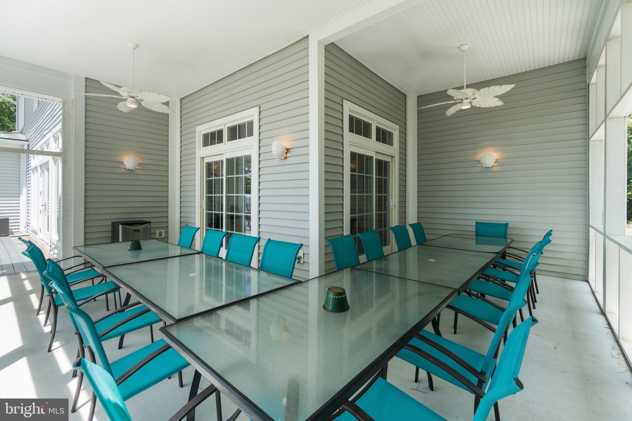 16271 Thomas Road Piney Point, MD 20674 - Photo 27 of 40 Wrap-around rear porch with plenty of seating.