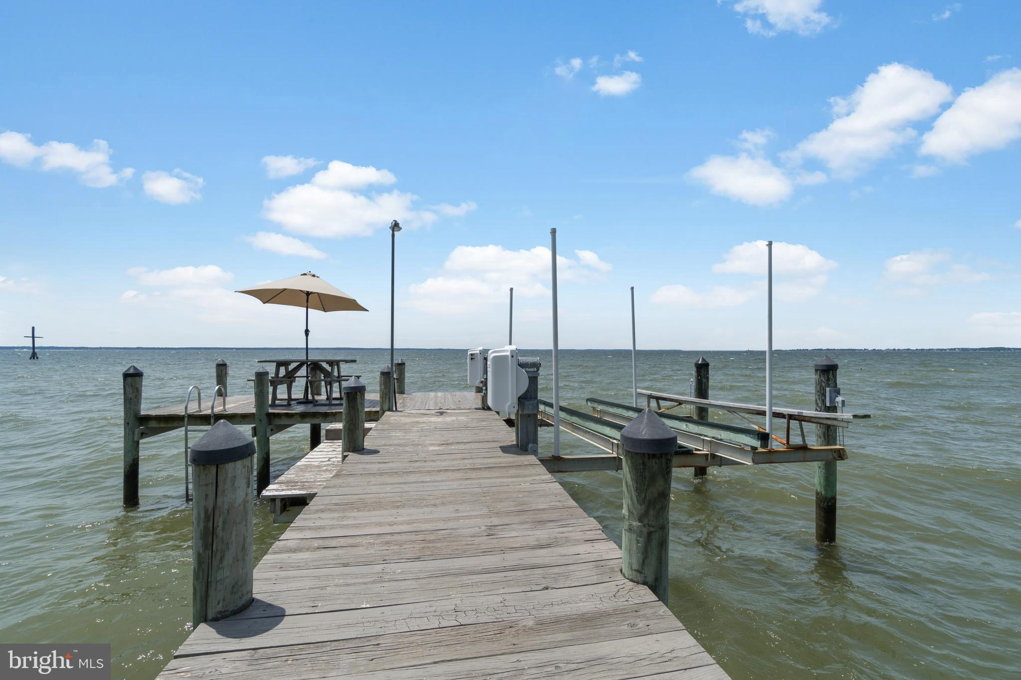 16271 Thomas Road Piney Point, MD 20674 - Photo 34 of 40 Boat lift and room for seating on the pier.