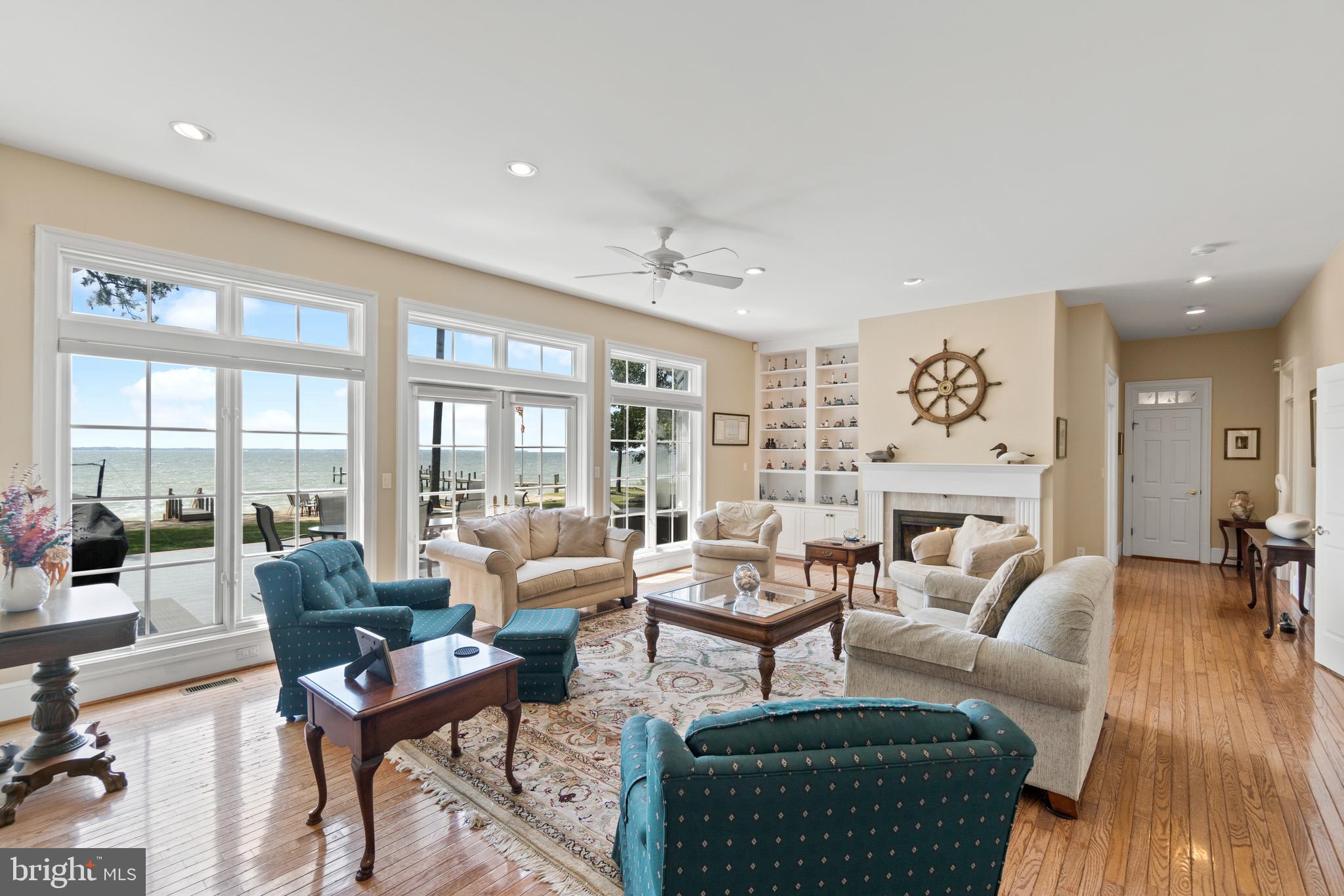 16271 Thomas Road Piney Point, MD 20674 - Photo 10 of 40 Stunning living room with wood-burning fireplace.