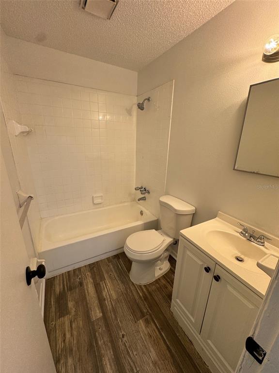 1735 Northeast 14th Street Ocala, FL 34470 - Photo 14 of 17 a bathroom with a sink a toilet and bathtub