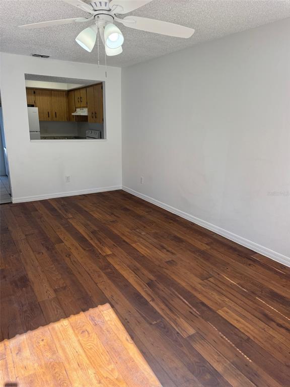 1735 Northeast 14th Street Ocala, FL 34470 - Photo 3 of 17 a view of an empty room with wooden floor and a window
