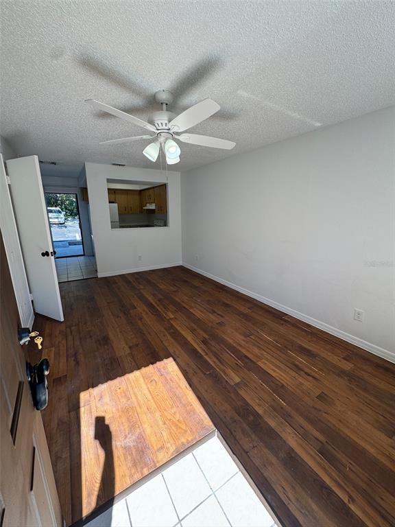 1735 Northeast 14th Street Ocala, FL 34470 - Photo 4 of 17 wooden floor in an empty room with a window