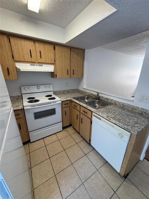 1735 Northeast 14th Street Ocala, FL 34470 - Photo 9 of 17 a kitchen with granite countertop a sink stove top oven and cabinets