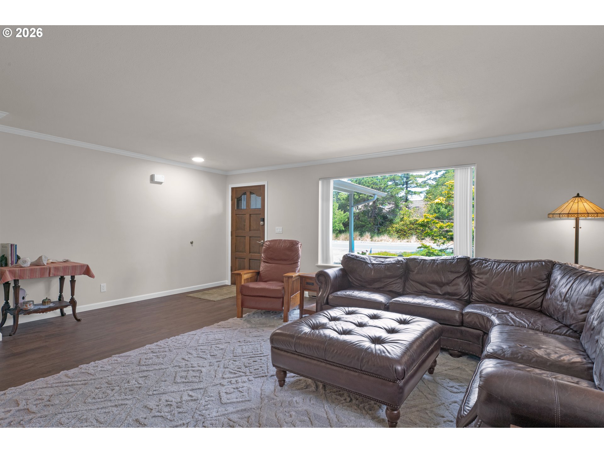 1142 9th Street Florence, OR 97439 - Photo 8 of 41 a living room with furniture and a large window