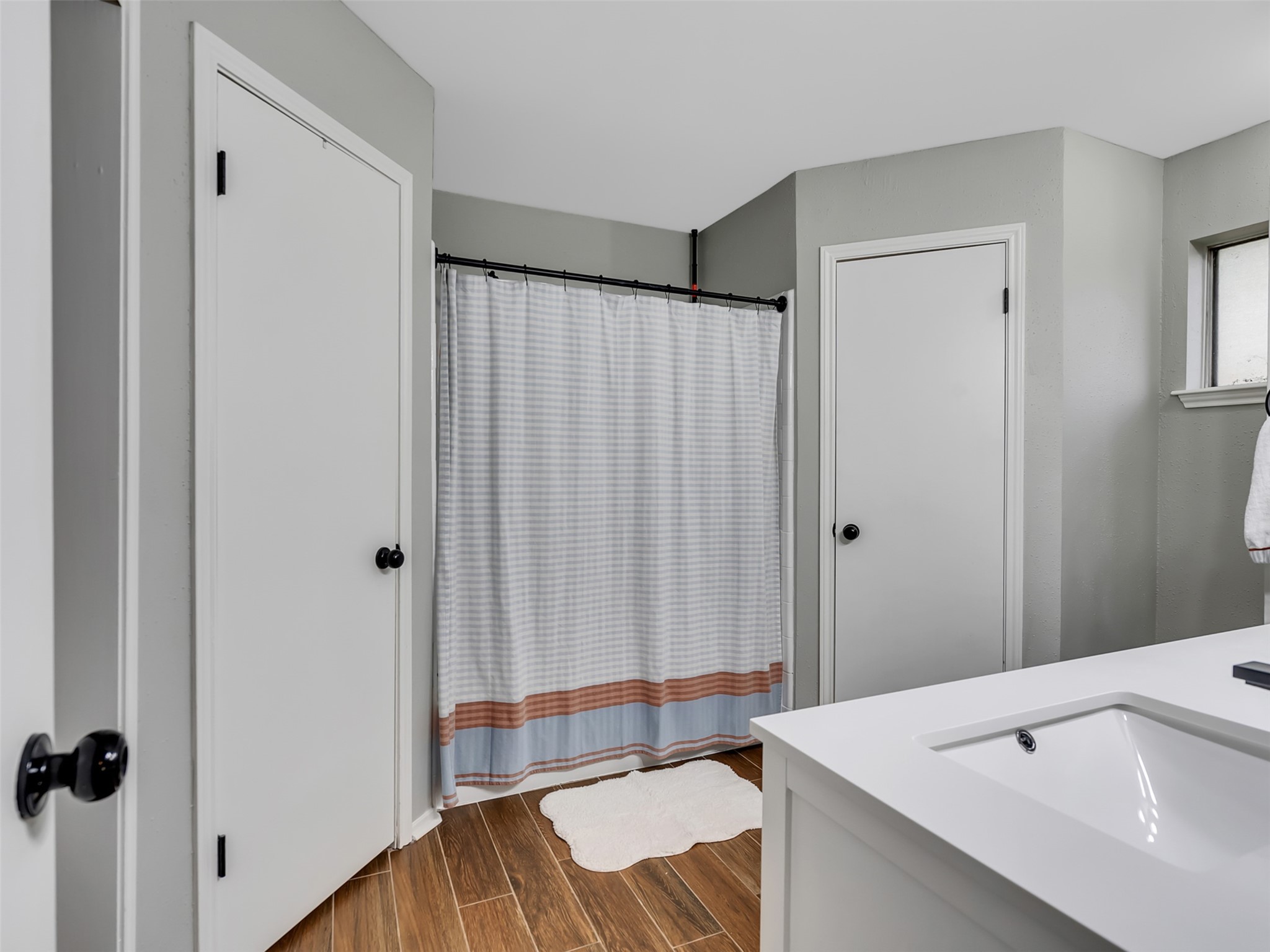 101 North Wagon Lane Angleton, TX 77515 - Photo 12 of 23 a bathroom with a sink and a large mirror