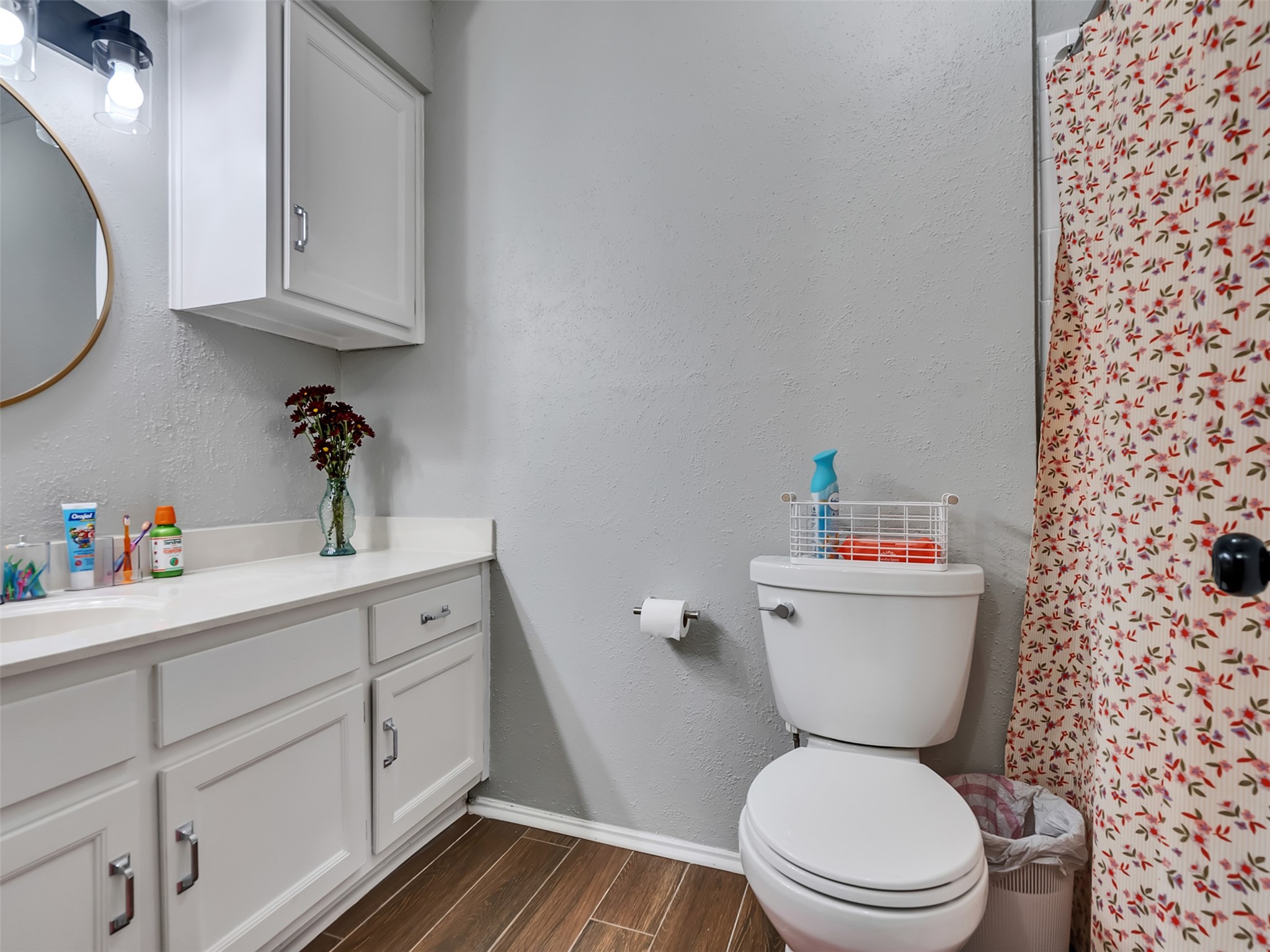101 North Wagon Lane Angleton, TX 77515 - Photo 16 of 23 a bathroom with a toilet sink and mirror