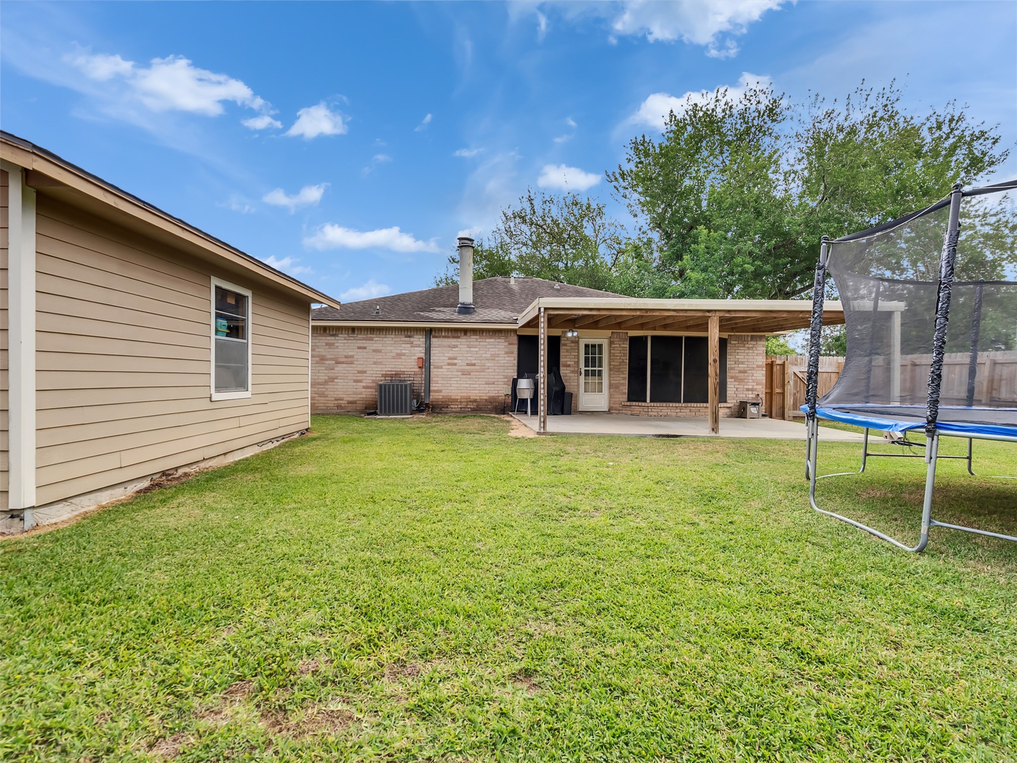 101 North Wagon Lane Angleton, TX 77515 - Photo 18 of 23 front view of a house with a yard
