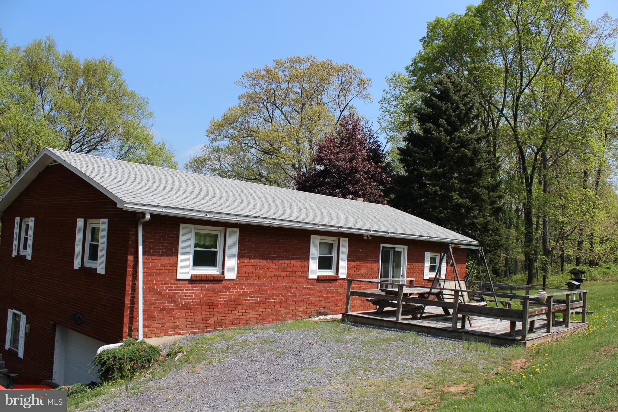 18198 Amberson Road Spring Run, PA 17262 - Photo 13 of 14 a front view of a house with a garden and sitting area