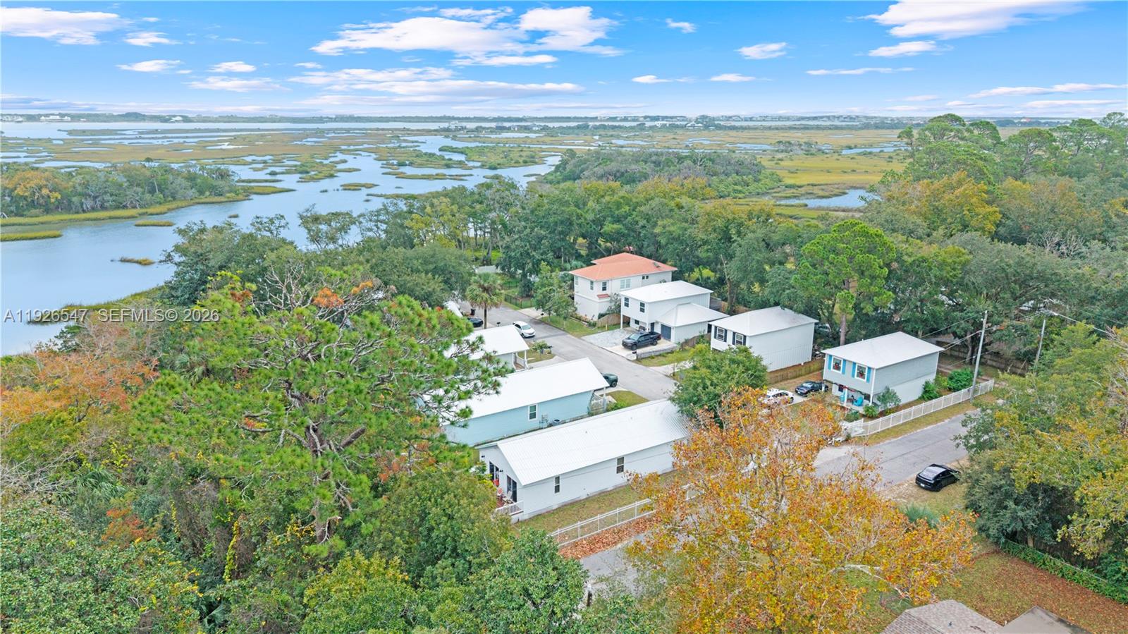 2 Poinciana Cove Road St. Augustine, FL 32084 - Photo 38 of 43 a view of a city from a lake